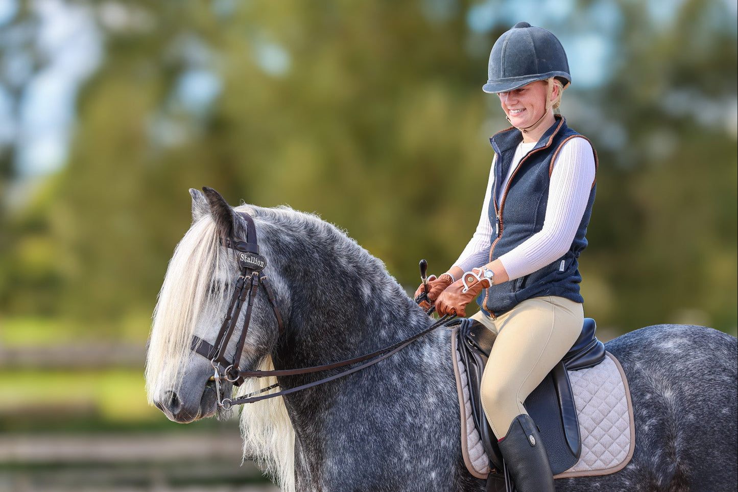 Model Riding with Foxbury Heritage Tan Gloves with White Piping